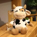 Cute Plush Cow Soft Toy – Adorable cow soft toy made with premium plush fabric, featuring a cute design, soft texture, and huggable filling, perfect for kids, playtime, cuddling, and gifting.