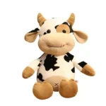Cute Plush Cow Soft Toy – Adorable cow soft toy made with premium plush fabric, featuring a cute design, soft texture, and huggable filling, perfect for kids, playtime, cuddling, and gifting.