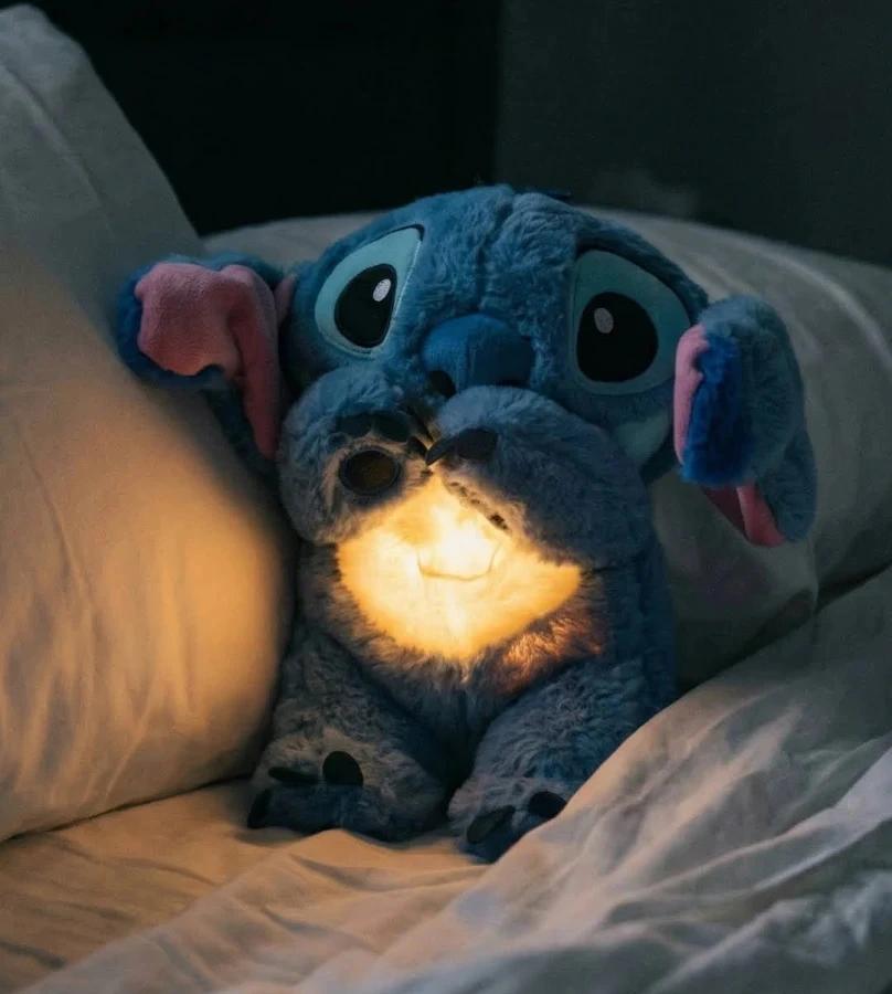 blue Breathing Stitch Plush Toy acts as a calming sleep soother for children and adults, featuring gentle breathing motions, soothing lights, and music